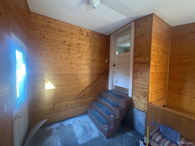 stairs with wood walls