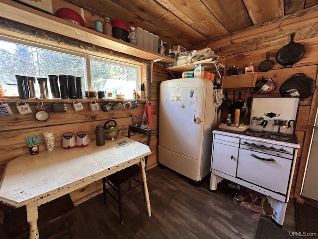 kitchen with wood ceiling, dark wood-style floors, and freestanding refrigerator