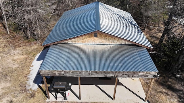 view of side of property featuring metal roof