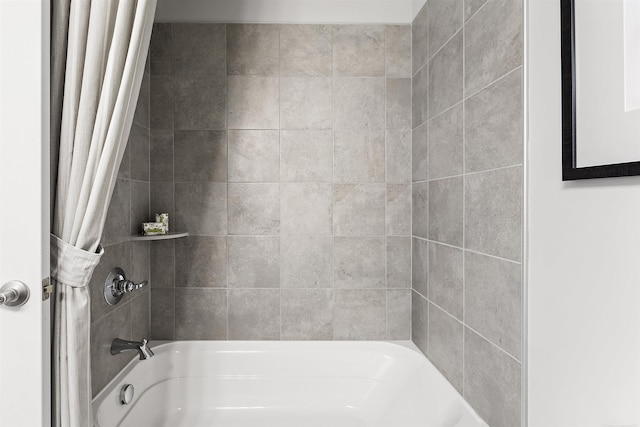 bathroom with shower / bath combination with curtain