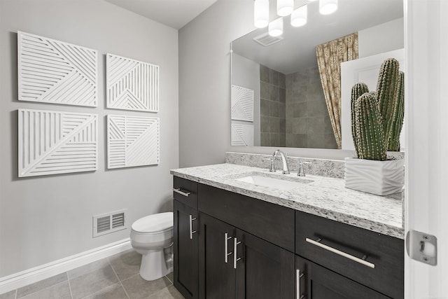 bathroom featuring tile patterned floors, visible vents, toilet, vanity, and baseboards