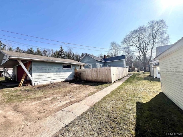 view of property exterior featuring fence