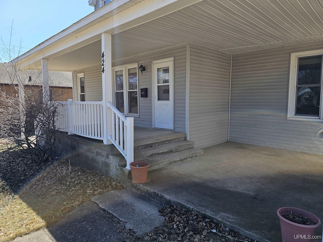 property entrance featuring covered porch