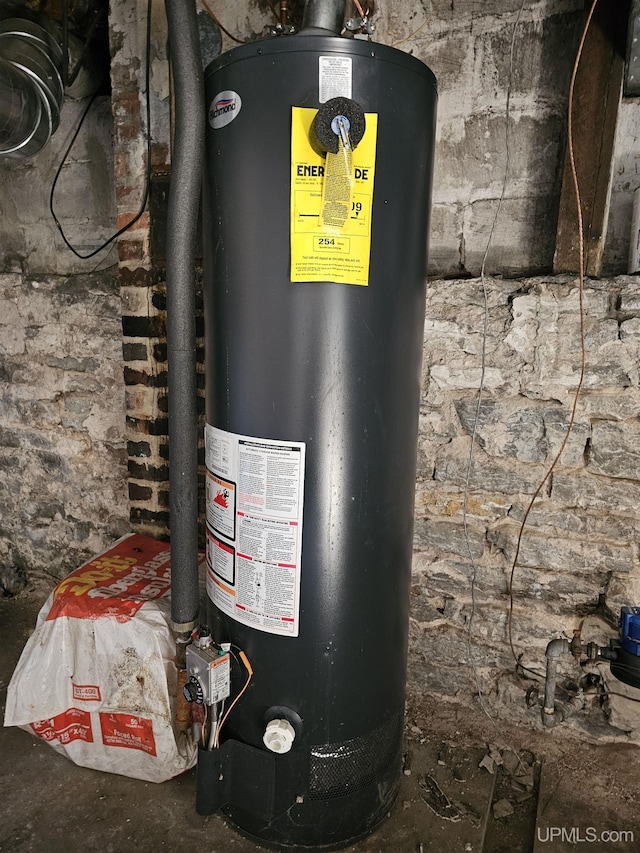 utility room featuring gas water heater
