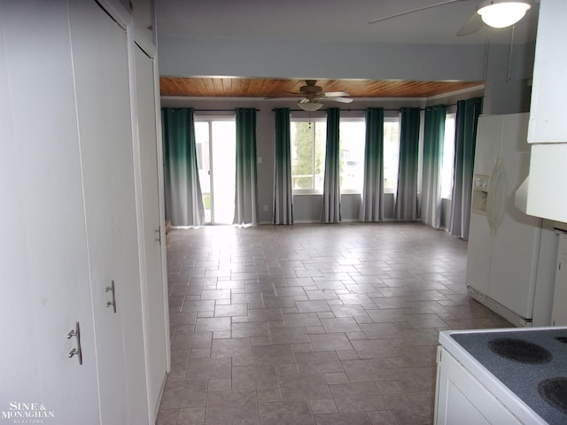 unfurnished room with wood ceiling and ceiling fan