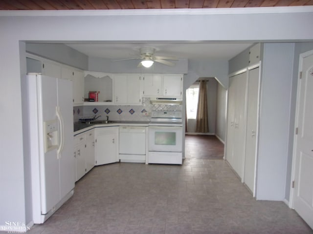kitchen featuring white cabinets, a sink, decorative backsplash, white appliances, and ceiling fan
