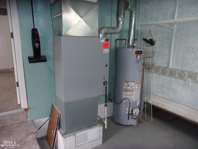 utility room with gas water heater