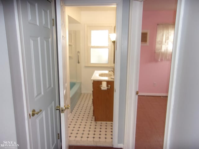 bathroom featuring baseboards and vanity