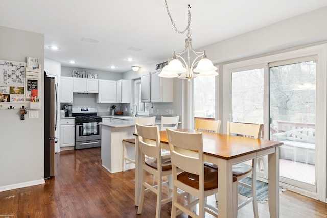 dining room featuring baseboards, an inviting chandelier, recessed lighting, and dark wood-style flooring