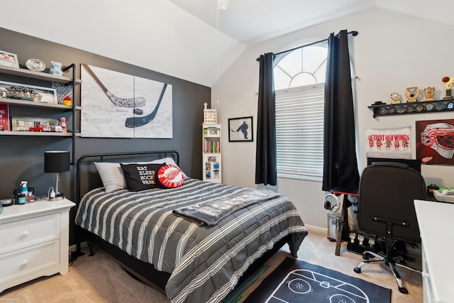 bedroom featuring light colored carpet and vaulted ceiling