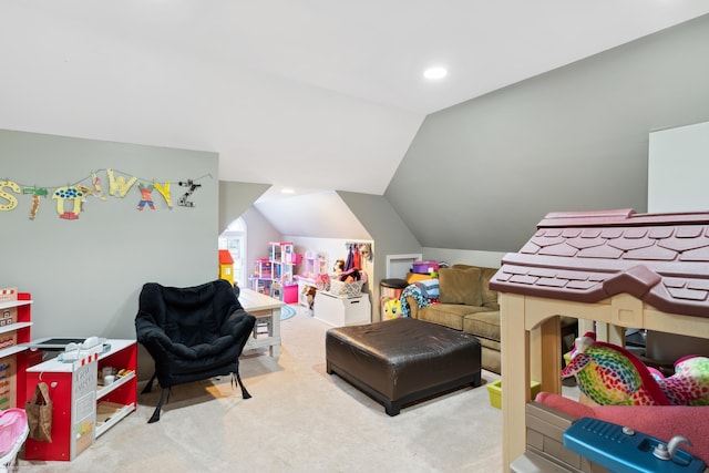 recreation room featuring vaulted ceiling and carpet flooring
