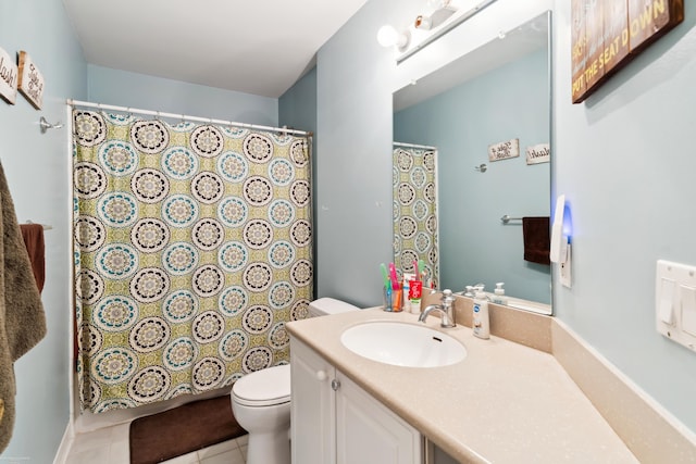 full bath featuring a shower with shower curtain, tile patterned floors, vanity, and toilet