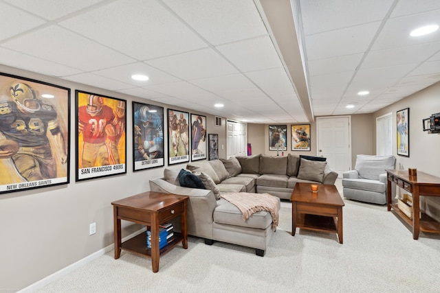 living area featuring a paneled ceiling, baseboards, carpet, and recessed lighting