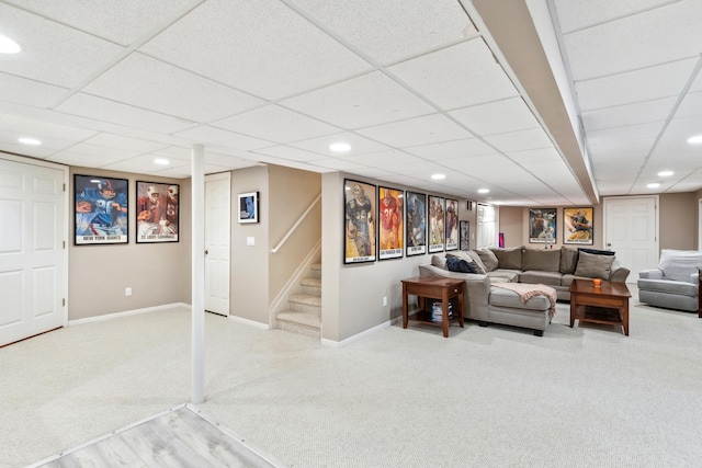 living room featuring carpet, baseboards, recessed lighting, and stairway