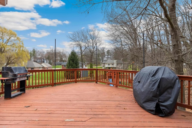 deck featuring grilling area and a residential view
