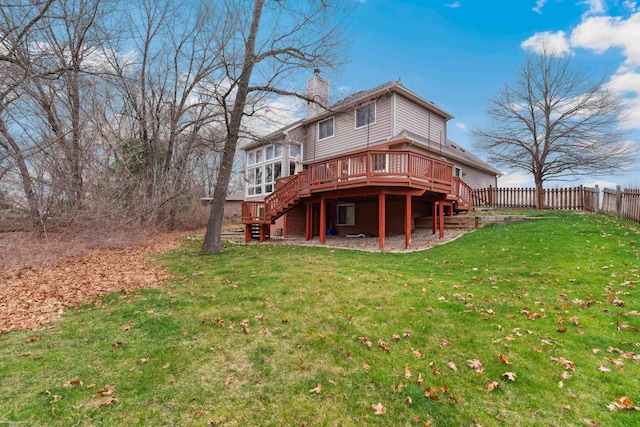 back of house with a chimney, fence, a wooden deck, stairway, and a yard