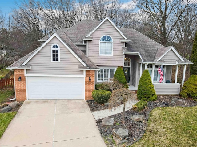 view of front of property with brick siding, driveway, roof with shingles, and covered porch