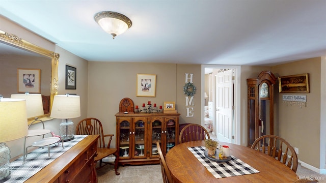 dining area with light colored carpet