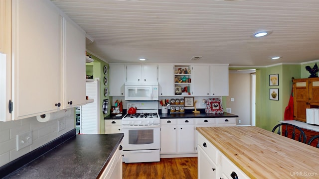 kitchen with white cabinets, open shelves, visible vents, white appliances, and butcher block countertops