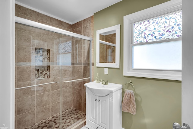 bathroom with vanity and a shower stall