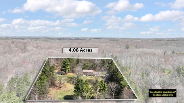 aerial view featuring a view of trees