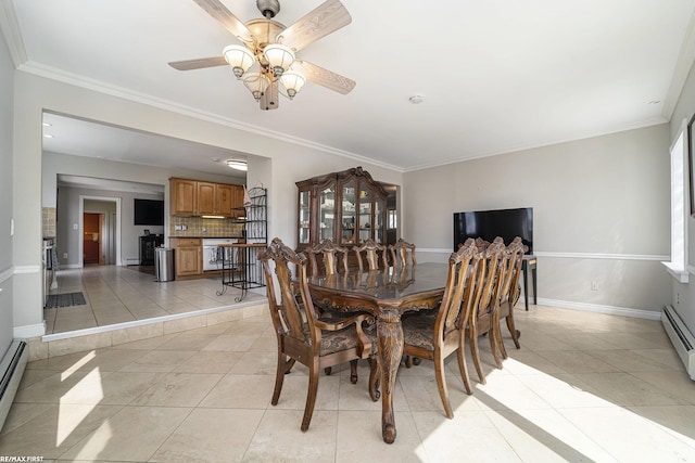 dining area with a ceiling fan, ornamental molding, and light tile patterned floors
