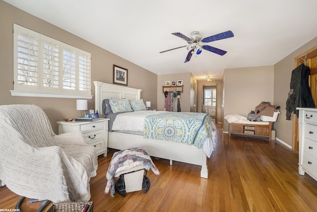 bedroom with wood finished floors and ceiling fan