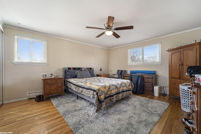 bedroom with a baseboard radiator, crown molding, a ceiling fan, light wood-style flooring, and baseboards