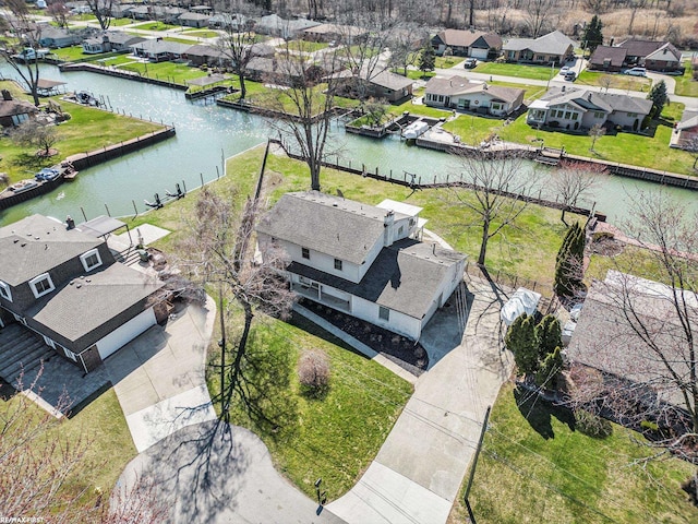 aerial view with a residential view and a water view