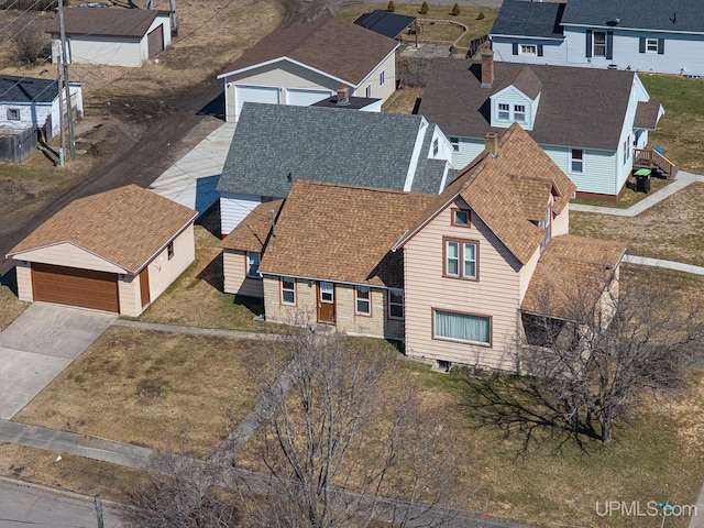 birds eye view of property with a residential view
