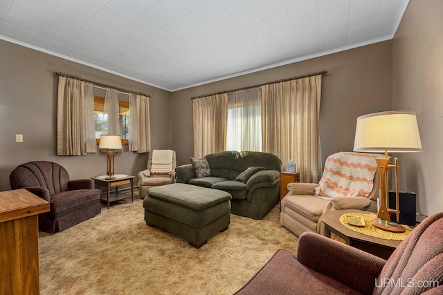 living room with plenty of natural light, carpet floors, and ornamental molding