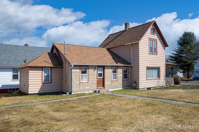traditional-style home with a front lawn, a chimney, and roof with shingles