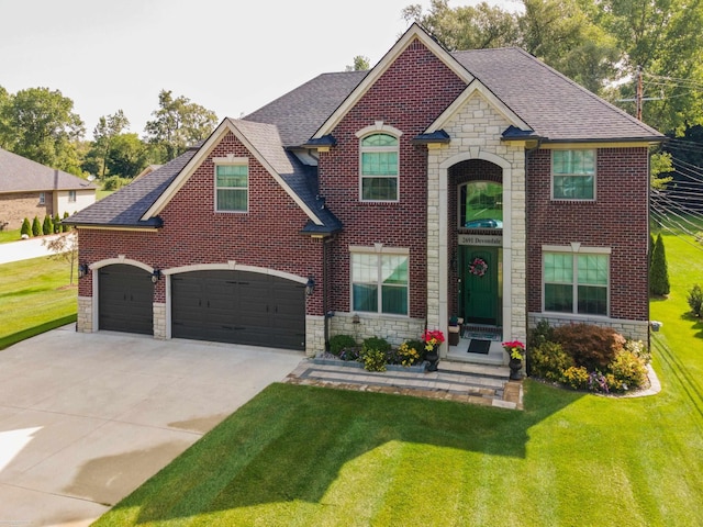 traditional-style house featuring stone siding, a shingled roof, a front yard, and concrete driveway