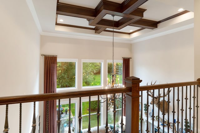 details with an inviting chandelier, ornamental molding, coffered ceiling, and beam ceiling