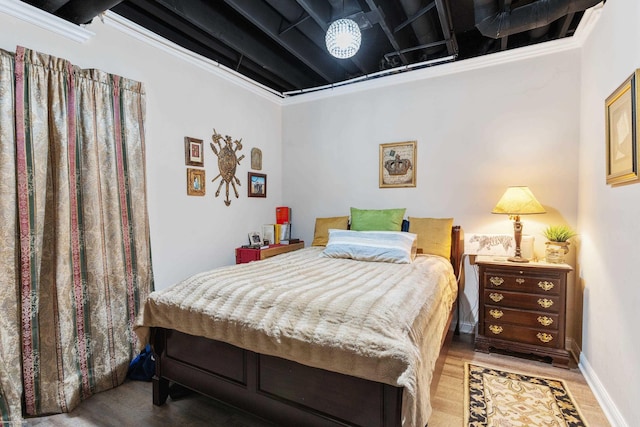 bedroom with wood finished floors