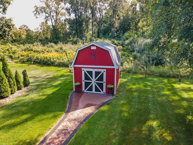 view of barn with a lawn