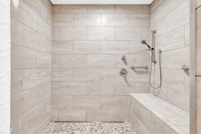 full bath featuring tiled shower