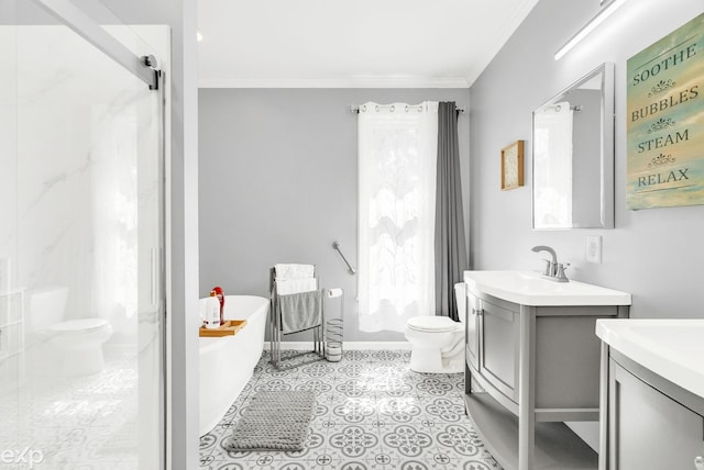 bathroom with crown molding, a freestanding tub, toilet, and vanity