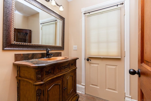 bathroom with tile patterned floors and vanity