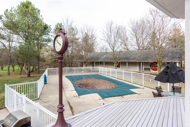 view of pool with a patio area, a fenced in pool, outdoor dining area, and fence