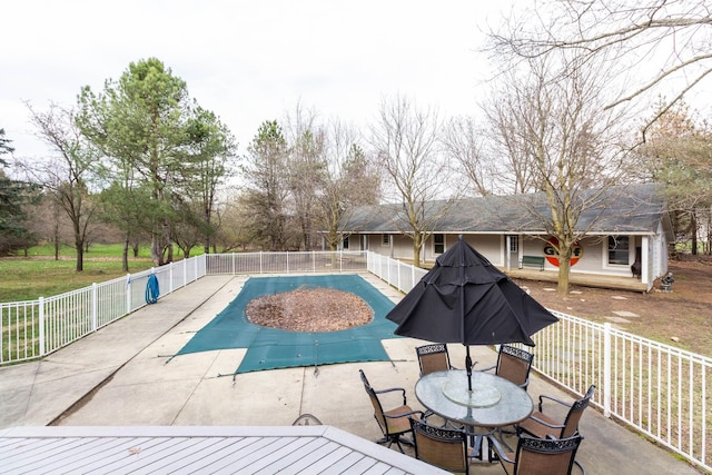 view of swimming pool featuring a patio area, fence private yard, and a fenced in pool