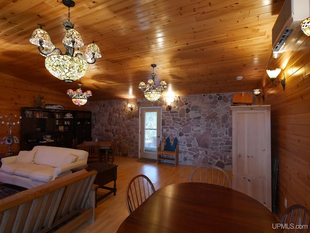 dining room with vaulted ceiling, wood finished floors, wooden ceiling, and a notable chandelier