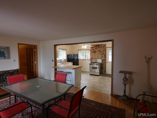 dining area with light wood-style floors