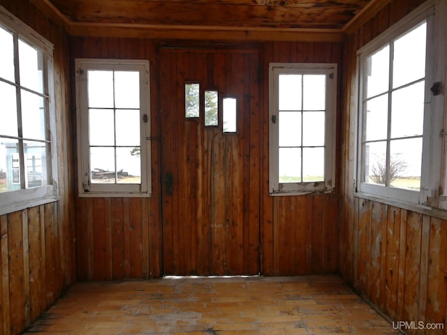 unfurnished sunroom with plenty of natural light