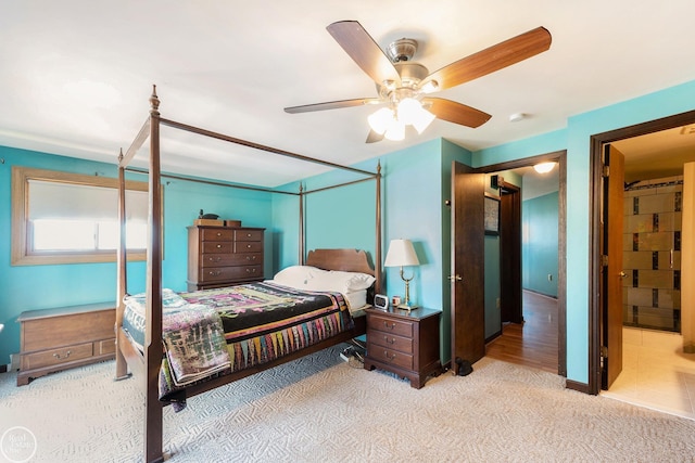 carpeted bedroom featuring a ceiling fan
