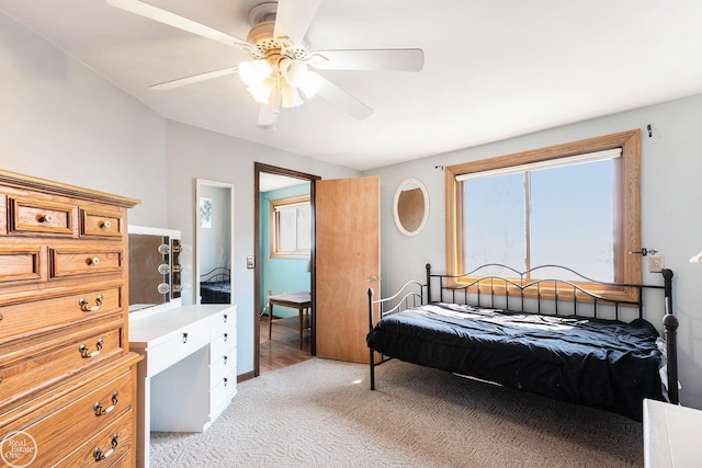 bedroom with light carpet and ceiling fan