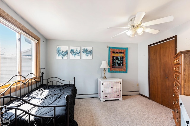 bedroom featuring baseboards, carpet, baseboard heating, and ceiling fan