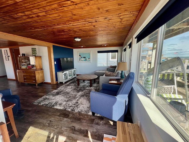 living area with baseboards, wood finished floors, crown molding, and wooden ceiling