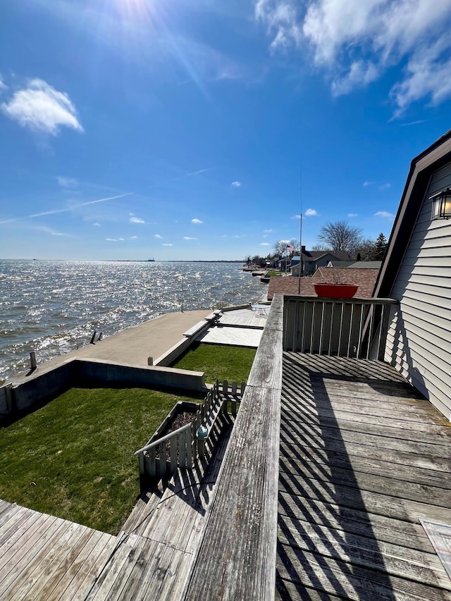wooden deck featuring a water view
