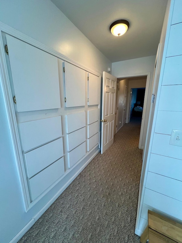 hall featuring carpet